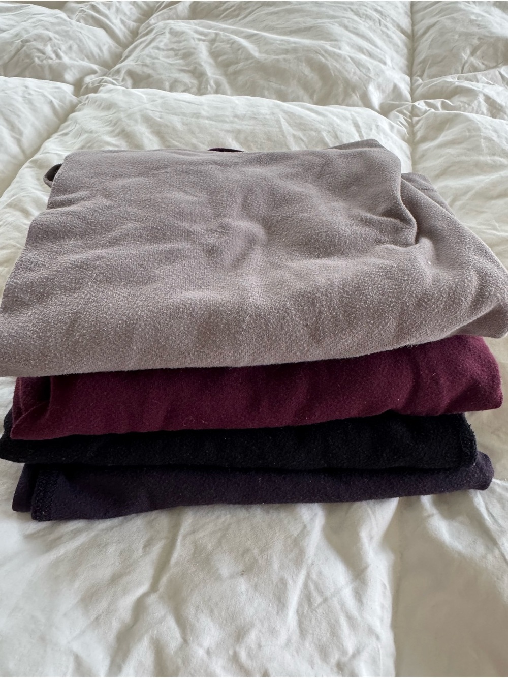 Lululemon racerback tanks in Taupe, Burgundy, Black, and Deep Plum